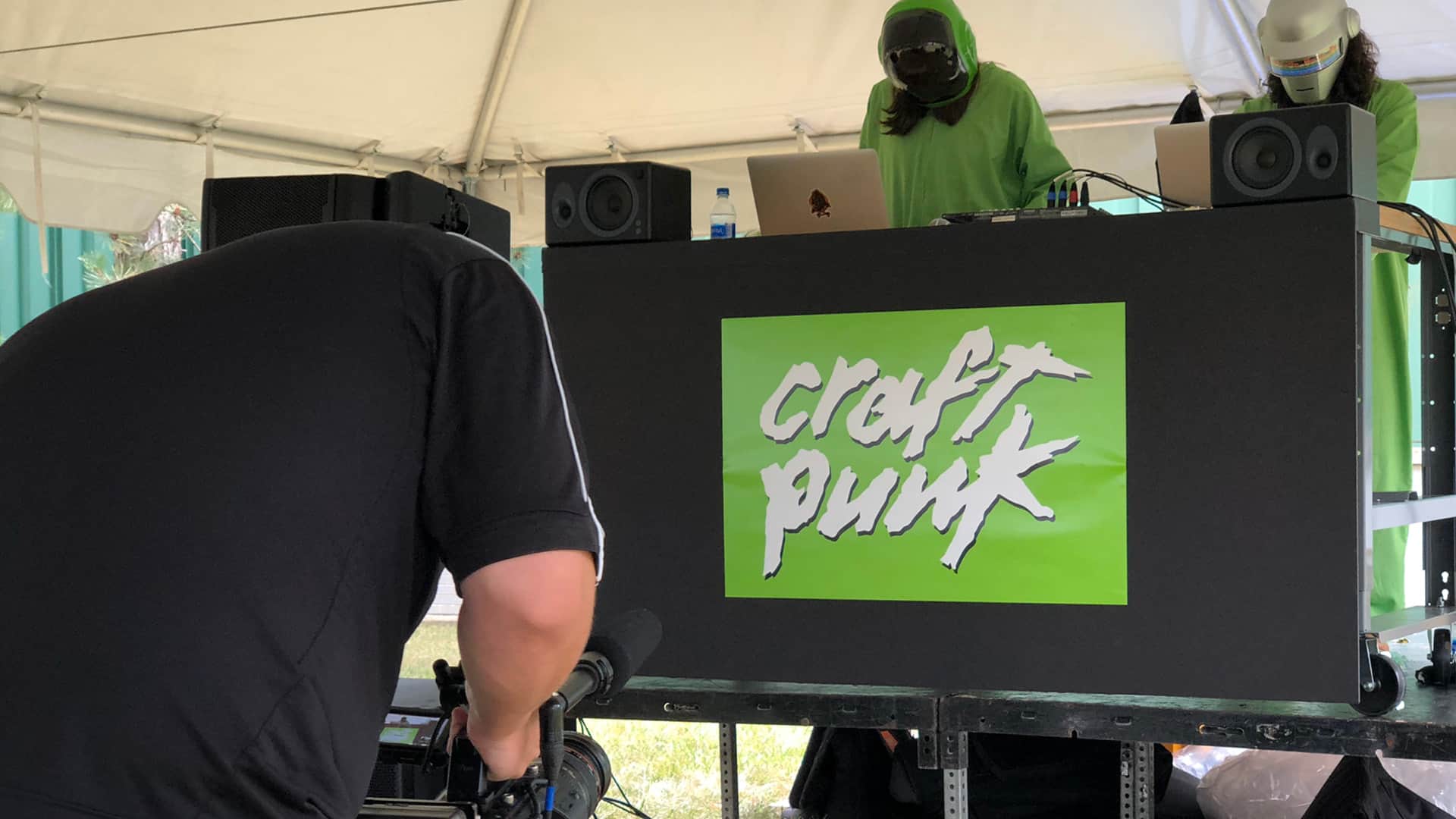 person filming sign that says "Craft Punk"