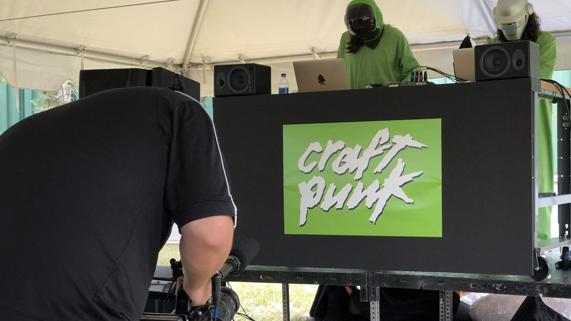 person filming sign that says "Craft Punk"