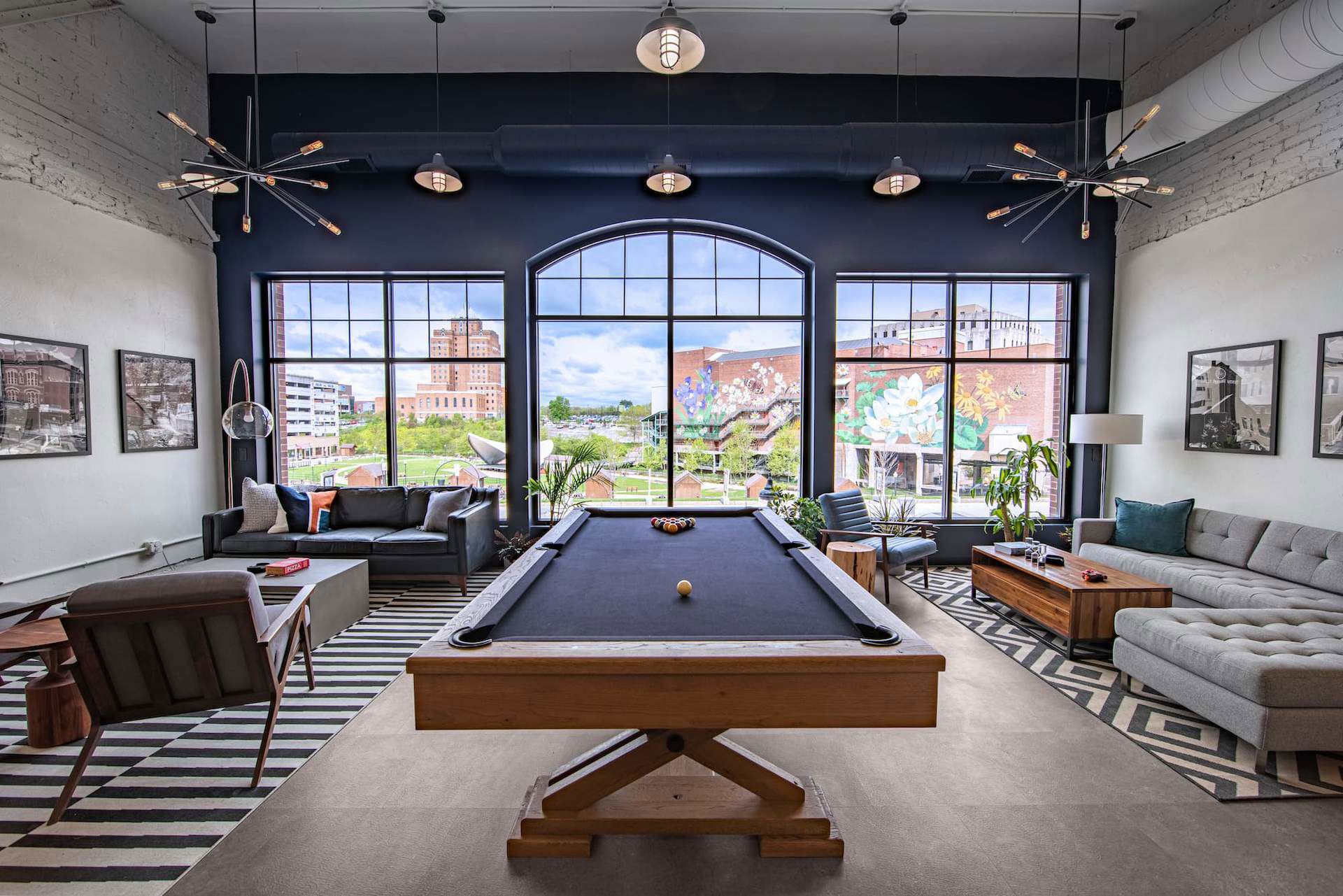 Front Lounge Area with pool table, couches and large front windows overlooking Lock 3