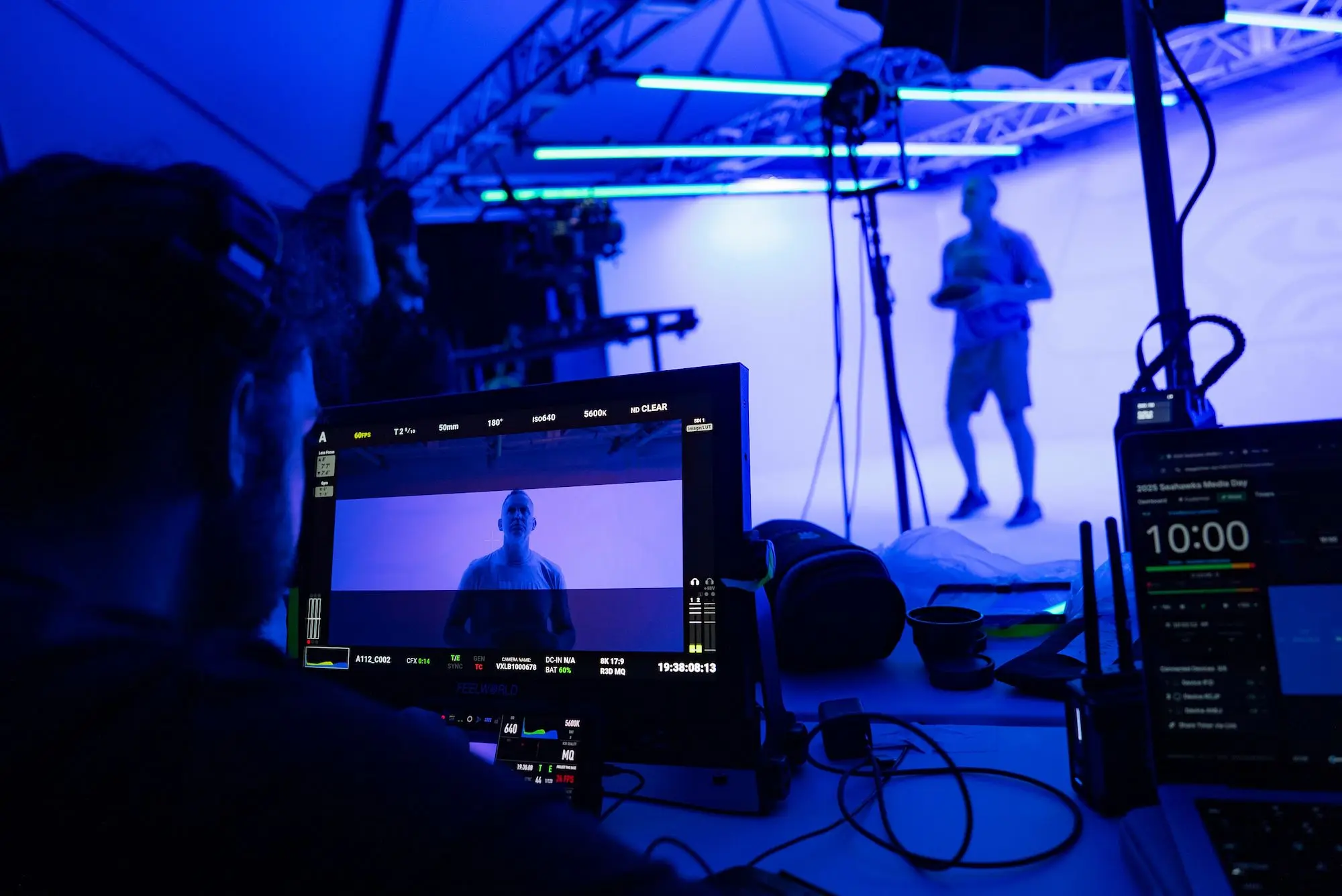 Pritt Entertainment Group Services, over the shoulder behind the scenes look at Seattle Seahawks 2025 Intro video with man standing in