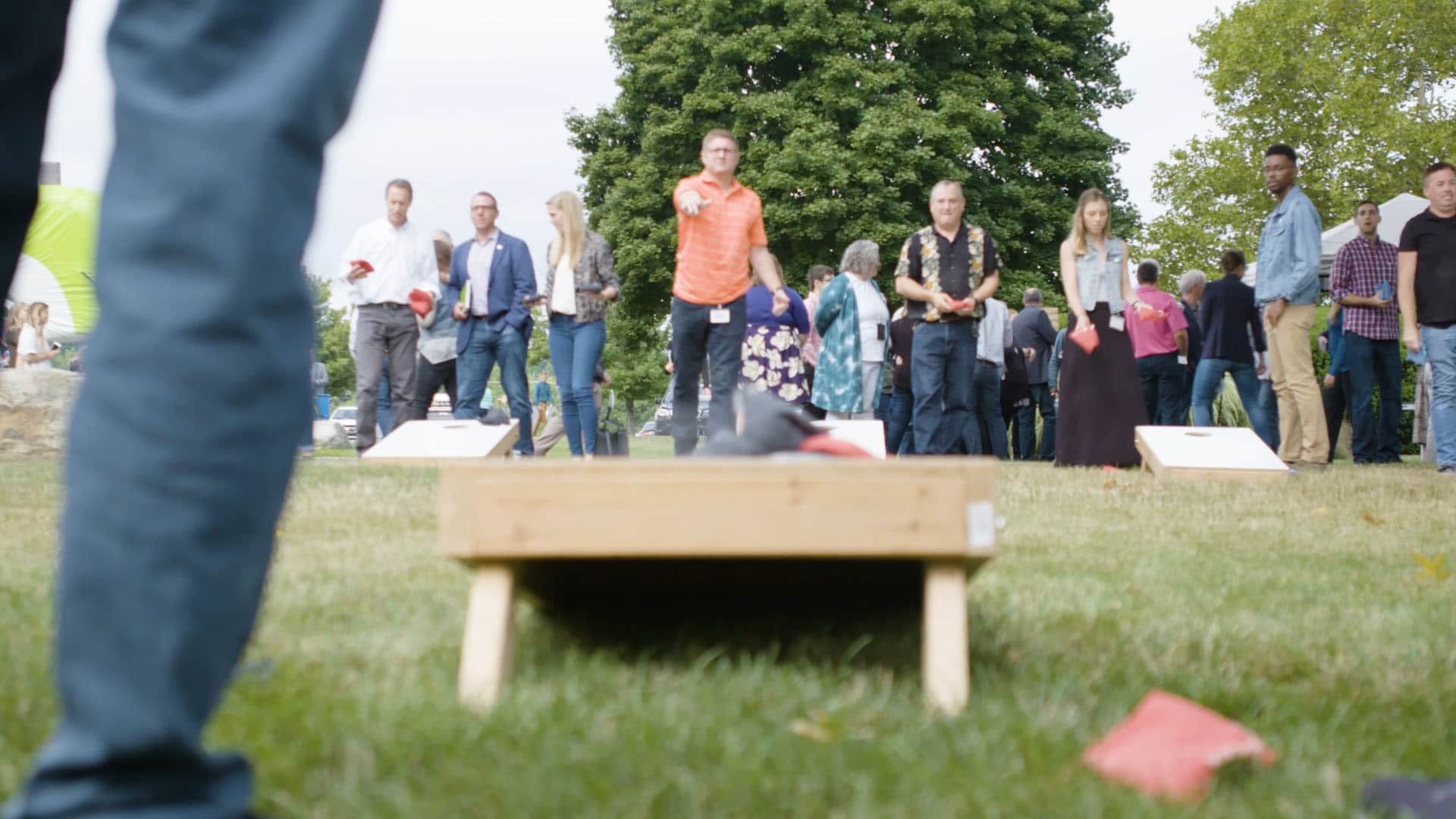 People playing cornhole